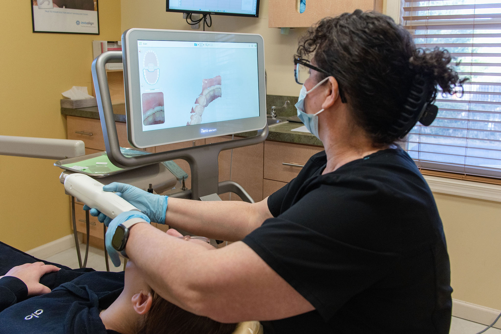 Dr. Kreitman fitting an Invisalign tray